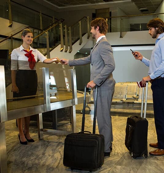 Travelers at an airport check-in desk
